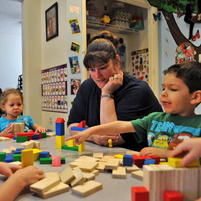 teacher-playing-with-kids-400x400-2